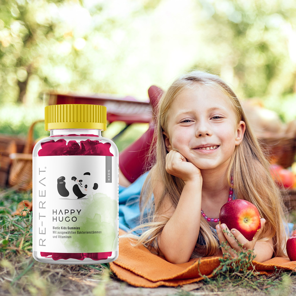 Kind liegt vor Happy Hugo Biotic Kids Gummies